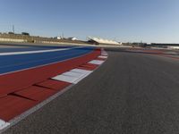 Asphalt Road under Clear Sky at Race Track