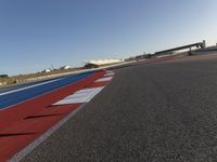 Asphalt Road under Clear Sky at Race Track