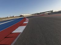 Asphalt Road under Clear Sky at Race Track