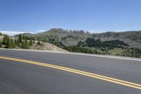 Asphalt Road in Colorado: Driving through the Highland Mountains