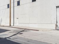 Asphalt Road and Concrete Building: A Photographic View