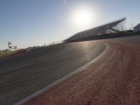 Asphalt Road Curving Through Field