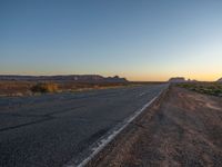 Asphalt Road at Dawn in Monument Valley, Arizona, USA