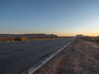 Asphalt Road at Dawn in Monument Valley, Arizona, USA