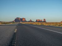 Asphalt Road at Dawn in Monument Valley, USA