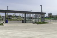 an empty terminal with no passengers on the tarmac, and a man in the distance