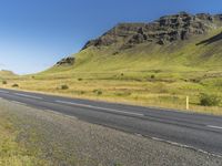 Asphalt Road through Highland Landscape in Iceland