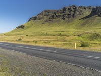 Asphalt Road through Highland Landscape in Iceland