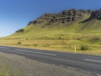 Asphalt Road through Highland Landscape in Iceland