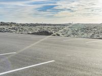 Asphalt Road in Iceland: Winding Through a Grassy Landscape