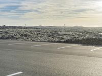 Asphalt Road in Iceland: Winding Through a Grassy Landscape