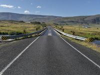 An Asphalt Road in Iceland: Surrounded by Mountains and Stunning Landscape