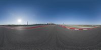 an image of a 360 - degree view looking down on the ground in front of a track