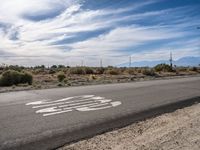 Asphalt Road in Los Angeles: A Desert Landscape Under Clear Skies