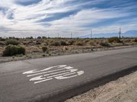 Asphalt Road in Los Angeles: A Desert Landscape Under Clear Skies