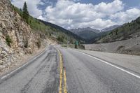 Asphalt Road with Low Mountain Landscape in Colorado