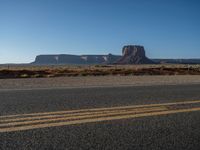 Asphalt Road in Monument Valley, Utah at Dawn