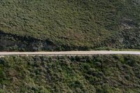 Asphalt Road through Mountain Pass: Aerial View