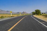 Asphalt Road in Thailand under Clear Sky