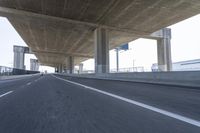 Underpass on a Grey Day: Asphalt Road
