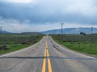 Asphalt Road in Utah: Clouds Above a Rural Landscape