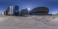 the empty parking lot is empty in this panoramic shot of a city skyline