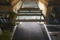 an overhead view of the entrance to the building that holds the train on the tracks