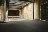 there is a view of a street from the building doorways at night that are busy with buildings