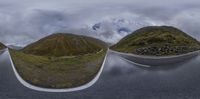 three panoramas of mountains and road going around in same direction to create a view