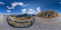 an image of a fisheye looking at the mountains in the background of this 360 - panorama