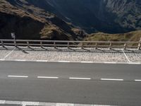 an empty road with no people in sight on it and a sign for the right way