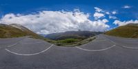 the view of a winding mountain pass is a beautiful scene in this fish - eye