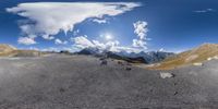 this is a 360 lens view of the mountain top mountains, and a sky that appears to be just above it