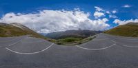 the view of a winding mountain pass is a beautiful scene in this fish - eye