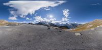 this is a 360 lens view of the mountain top mountains, and a sky that appears to be just above it