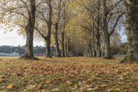 Autumn Landscape with Trees and Incidental People