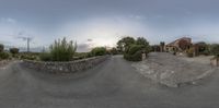 a very old stone house with trees on the side of it in a panoramic view