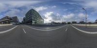 this is a fish eye view of a street from an empty road in front of an office building