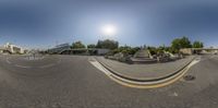 a fish eye view of the parking lot and stairs at the center of a street