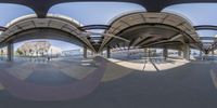 a fish eye view of an airport with many planes and planes parked on the tarmac