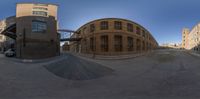 a 360 - lens view of buildings on a street corner and one is at the bottom