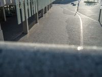 the road is empty on this busy street with the tall building in the background for pedestrians