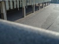 the road is empty on this busy street with the tall building in the background for pedestrians