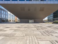 a closeup of a wooden walkway near many buildings in a city hall style building