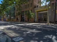 Barcelona's City Streets: Shadows and Vibrant Storefronts