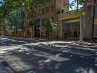 Barcelona's City Streets: Shadows and Vibrant Storefronts