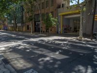 Barcelona's City Streets: Shadows and Vibrant Storefronts