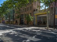 Barcelona's City Streets: Shadows and Vibrant Storefronts