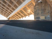 this is the underside of a bridge on a sunny day and it is not overcast, though