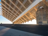 this is the underside of a bridge on a sunny day and it is not overcast, though